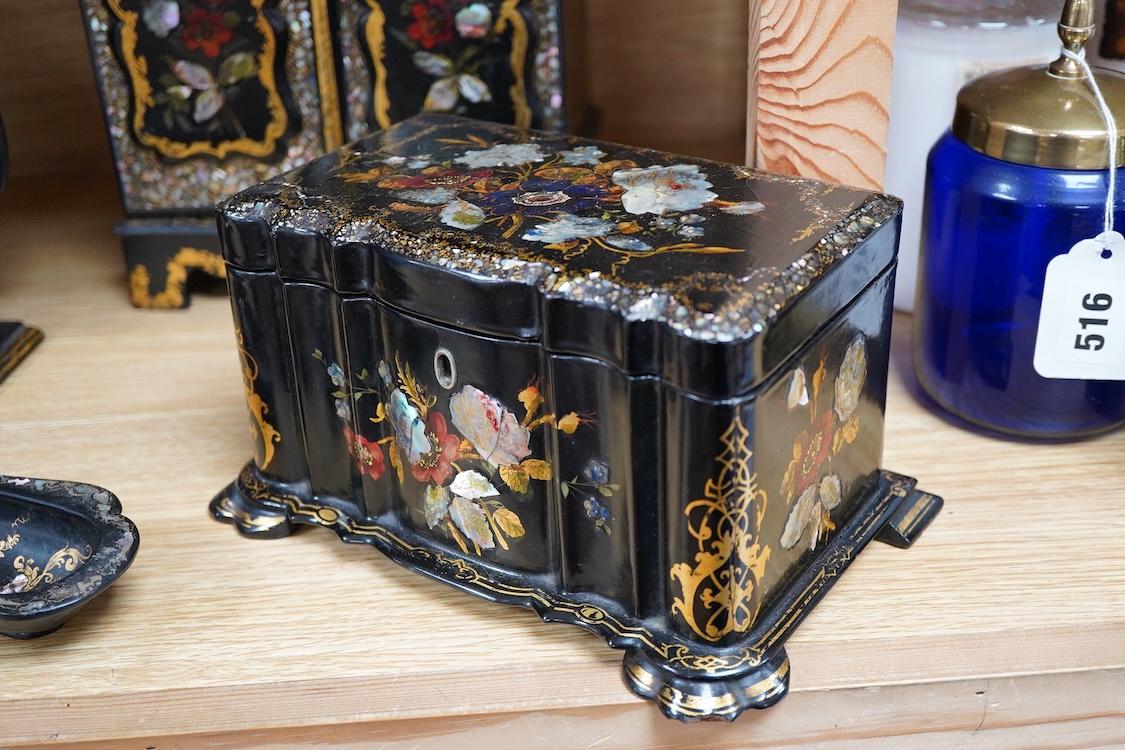 Four 19th century mother of pearl inlaid papier mache items, to include, a four drawer cabinet, 26.5cm high, a tea caddy, letter rack and pen dish